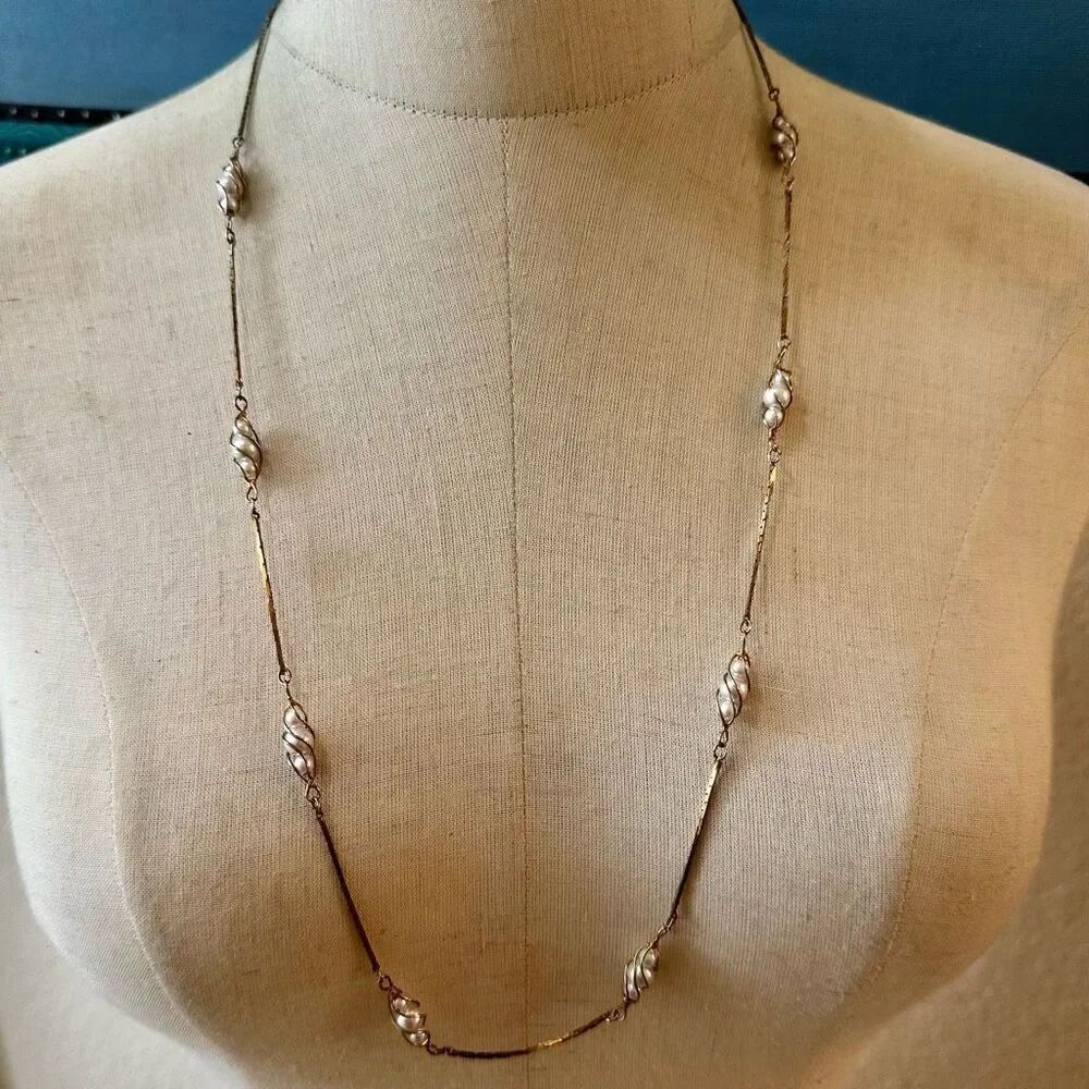 Gold tone faux pearl long necklace